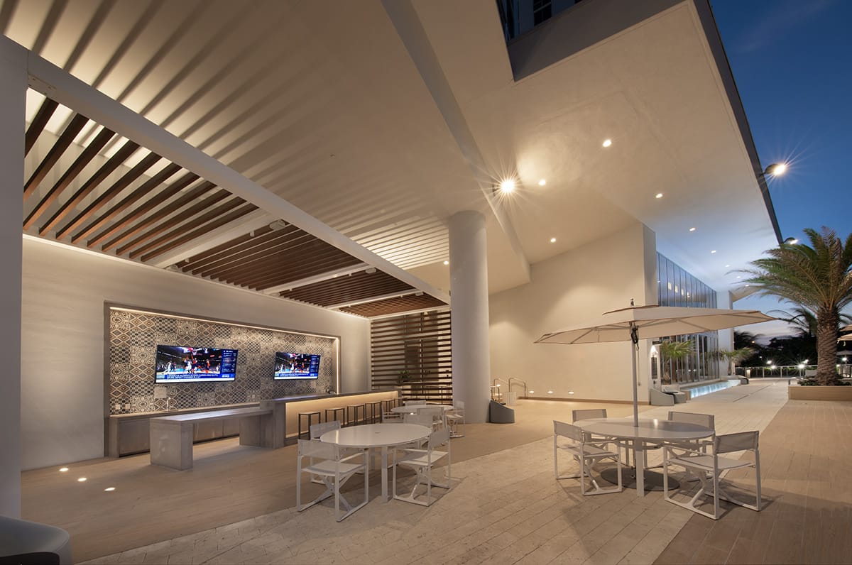 Outdoor lounge and bar terrace at The Harbour in the evening